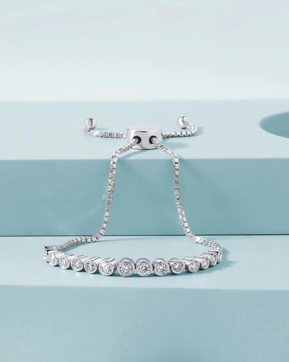 a necklace is on top of a light blue table