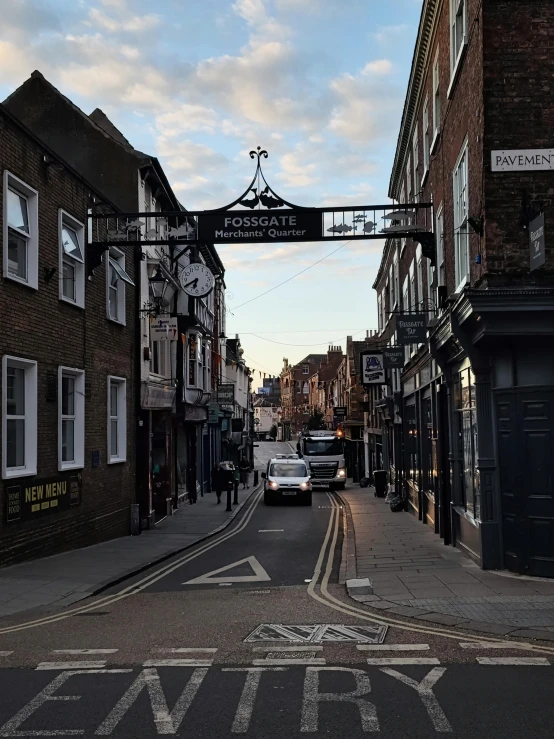 a city street with many shops on either side