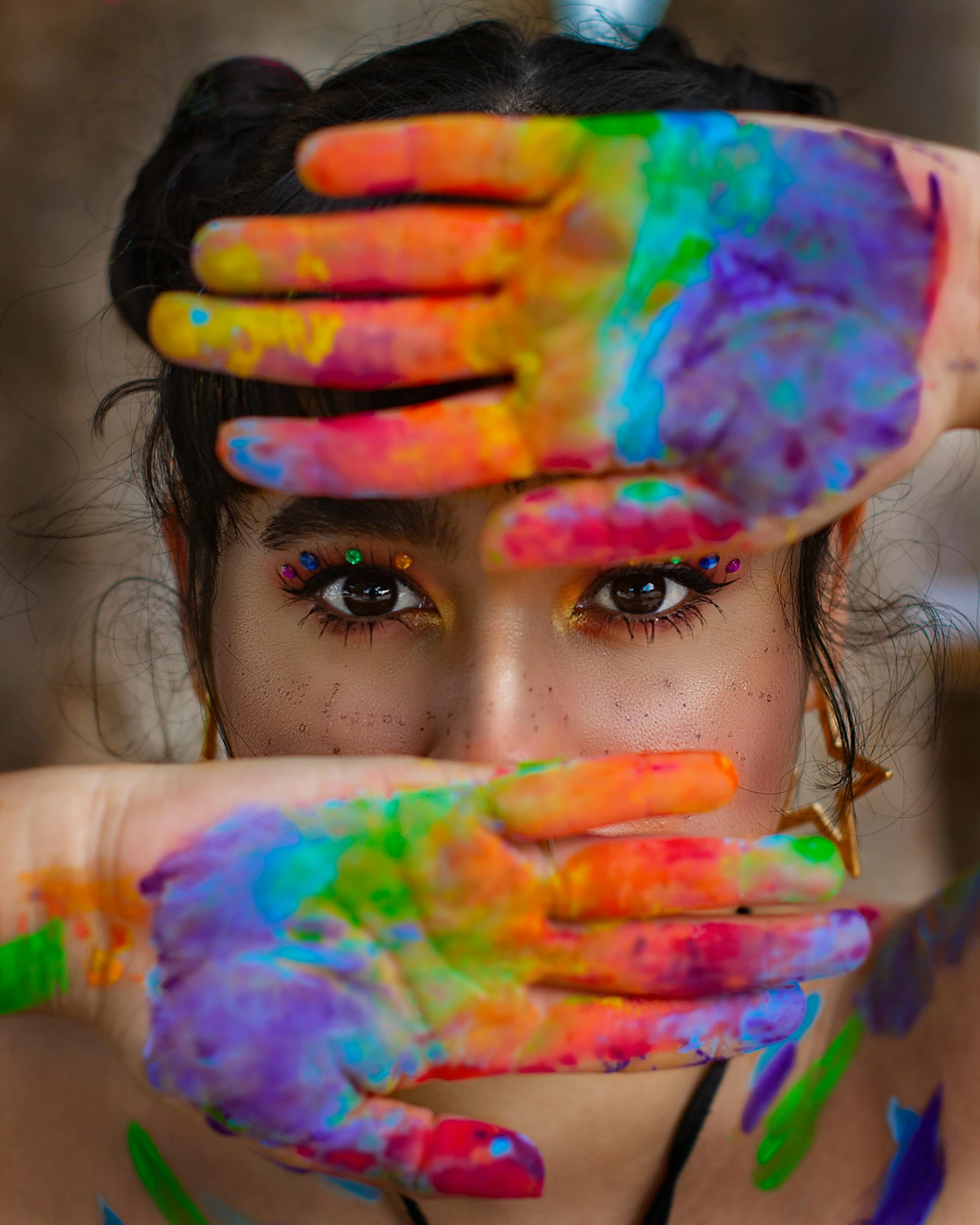 a woman holding her hands over their eyes