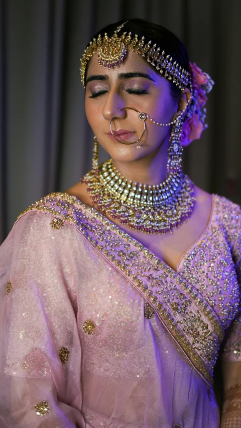 a woman wearing jewellery at a function