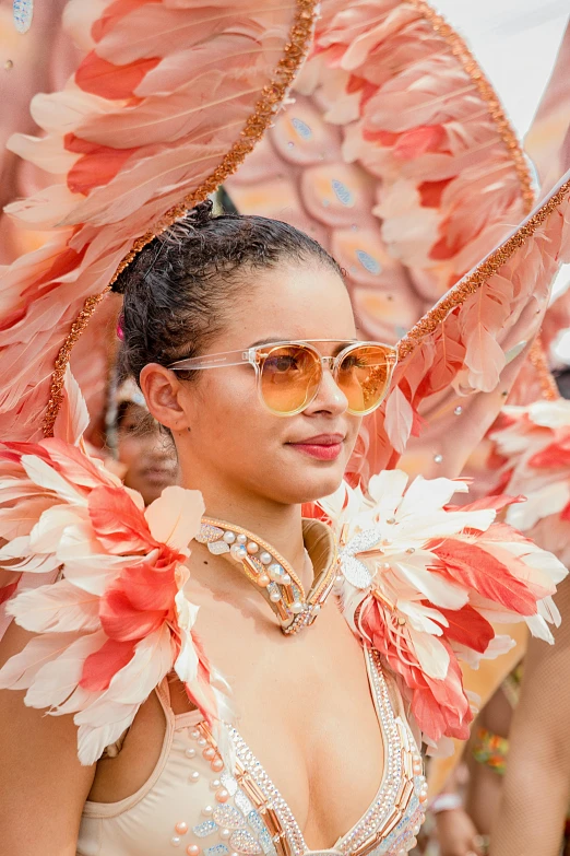 the woman in the large costume is dressed in colorful attire