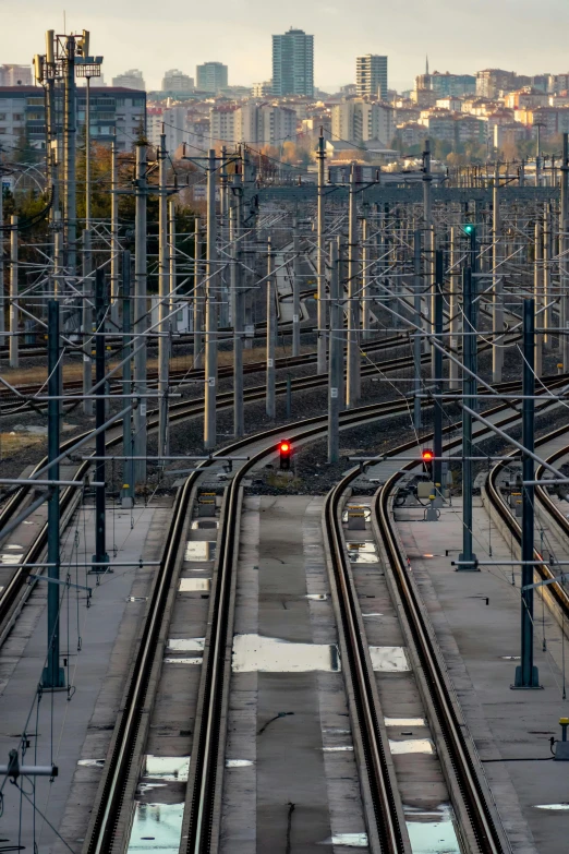 some red lights on the side of the tracks