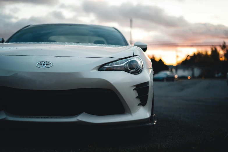 the front end of a white sports car