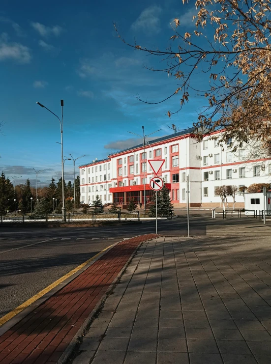 a red and white building near a red brick street