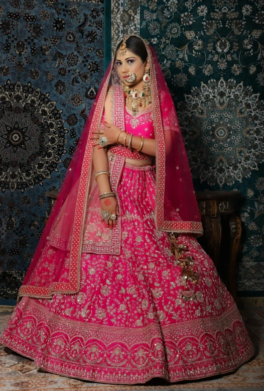 the bridal poses in pink, ethnic indian wedding dress