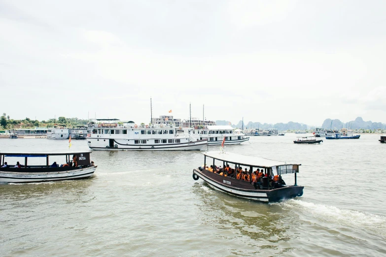 large boats in a body of water passing each other