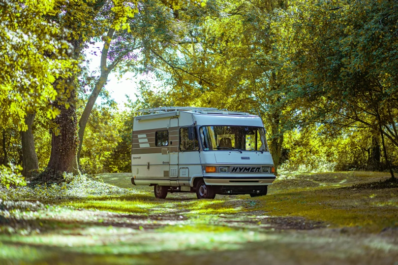 an rv is on the side of a narrow road