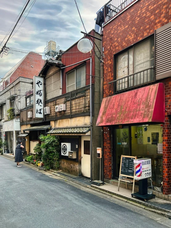 an empty street that has buildings on either side