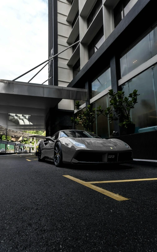 a car in the street in front of a building