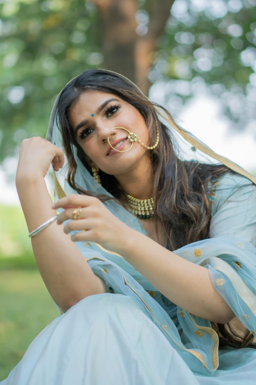 a beautiful young woman with nose ring and veil