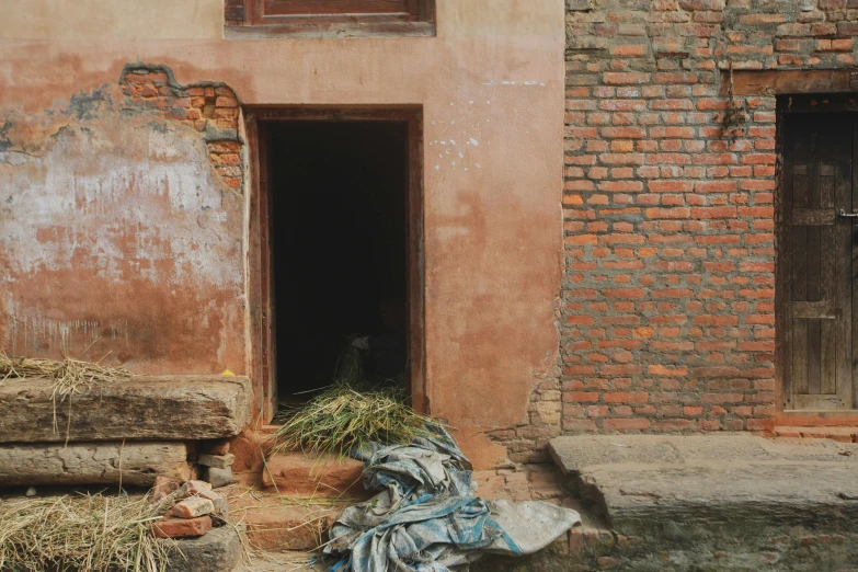 the side of an old building that looks damaged