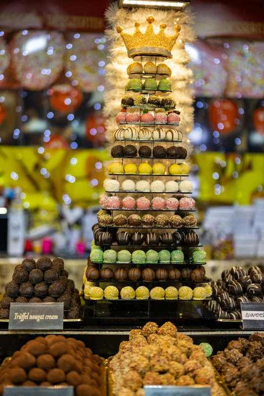 a variety of desserts in a display case at a store