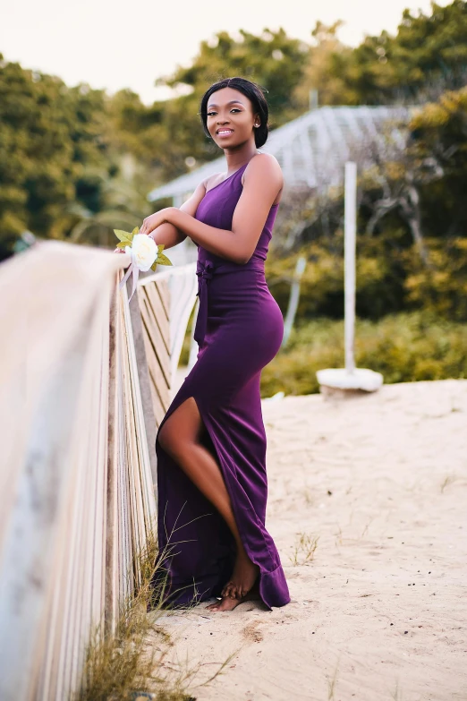 a beautiful black woman in a purple dress