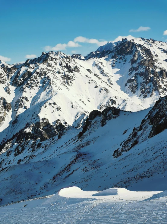 the snowy mountain range looks like it's been taken from an airplane