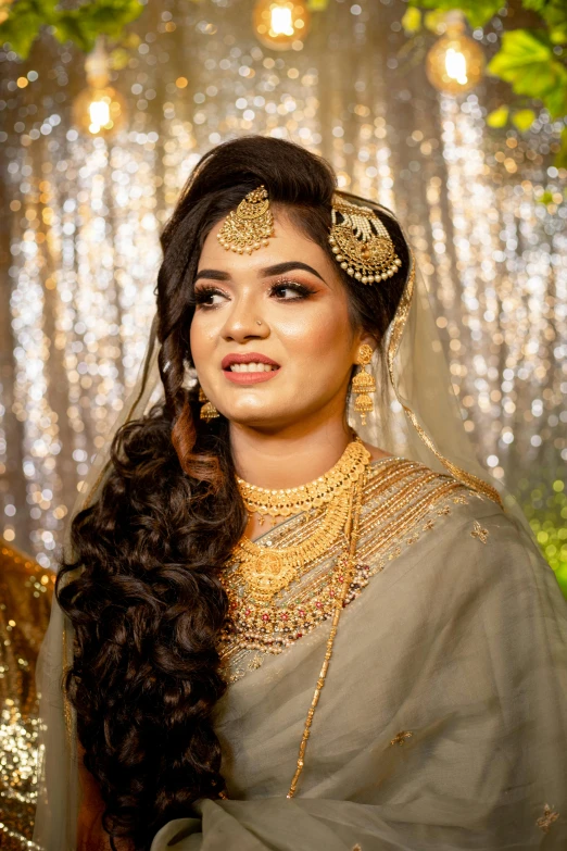 the beautiful lady is posing in her bridal dress