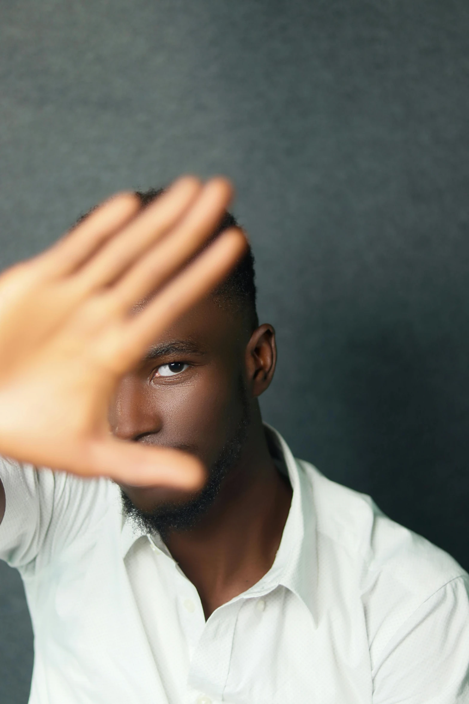 a man is holding his hands to the camera