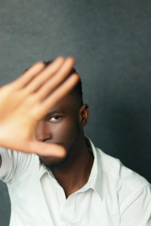 a man is holding his hands to the camera