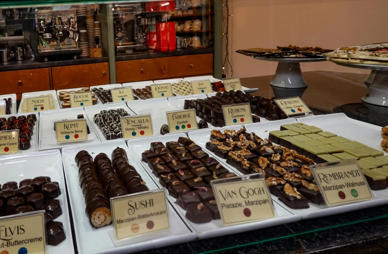 a table with a large amount of chocolates