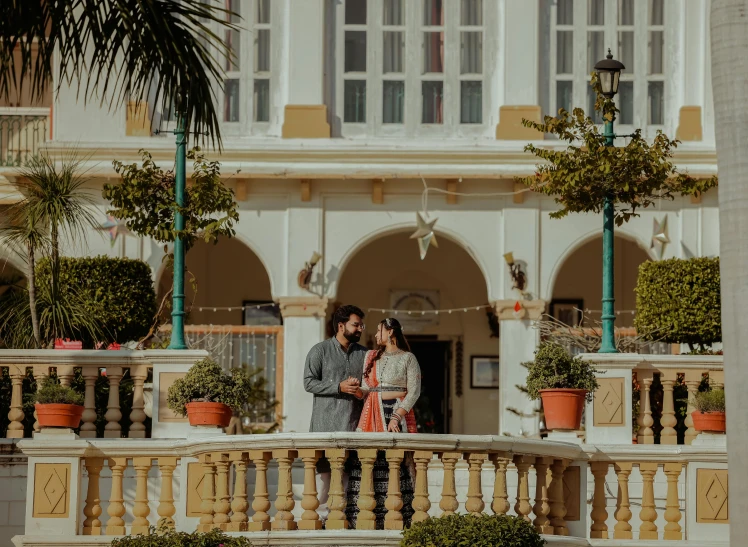 two people standing outside by the railing