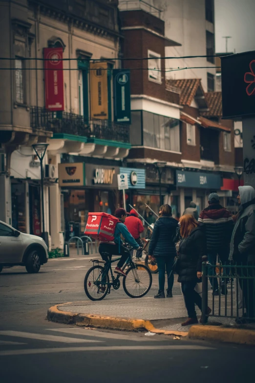 a person on a bicycle stopped at a pedestrian crossing