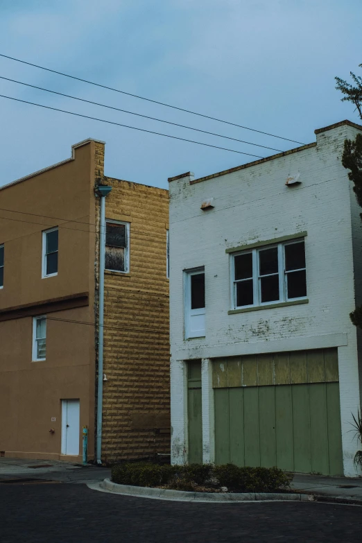 two buildings sit side by side next to each other