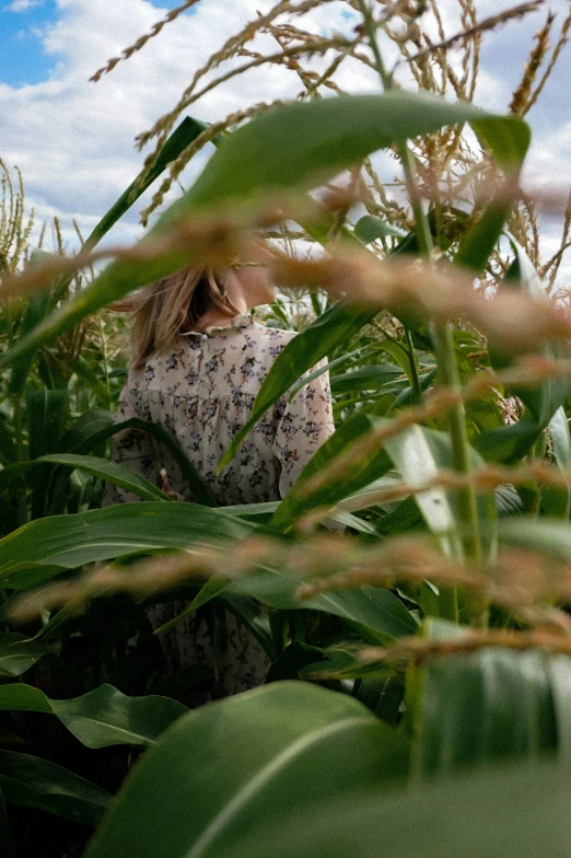 a woman standing in a field of grass