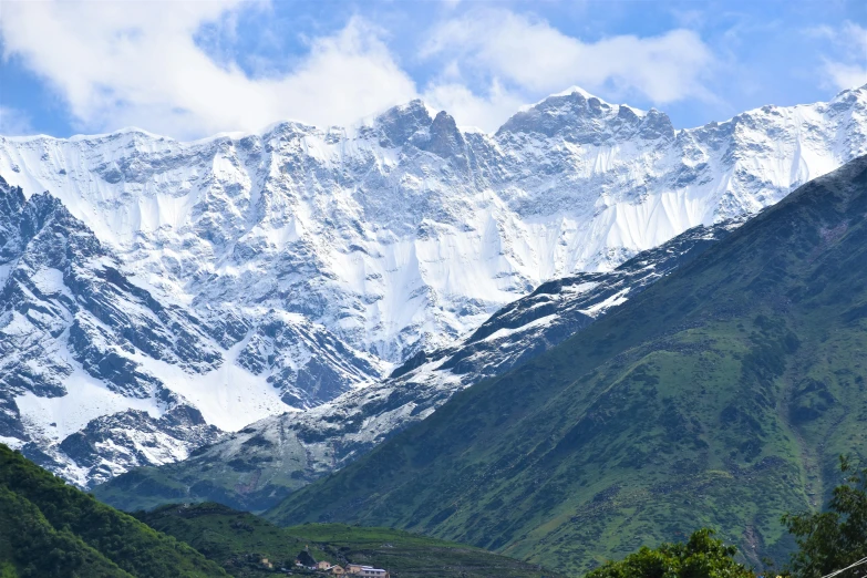 the mountain tops are covered in snow