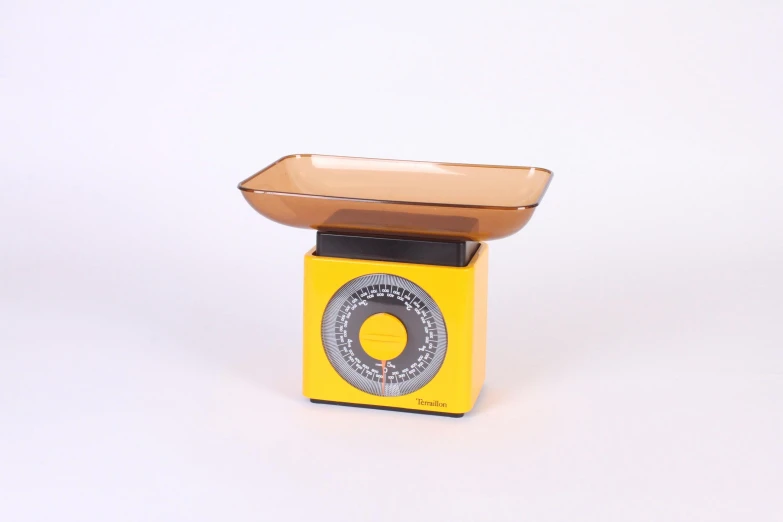 a yellow radio that is on the ground