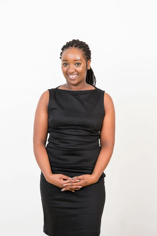 a woman in black standing on white background