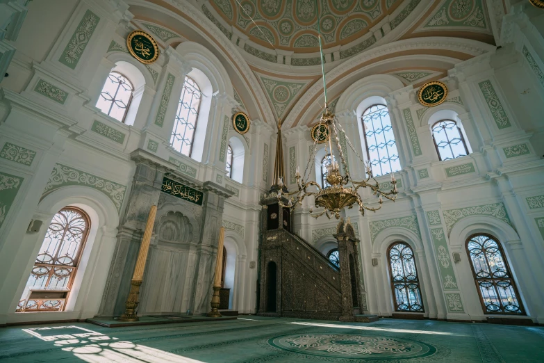 the interior of an ornately decorated building with a lot of windows