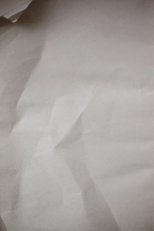 a large white piece of paper with soing white on top