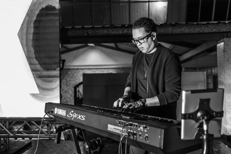 the young man plays his electronic keyboard at the event