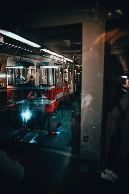 a group of people are on a bus in the dark