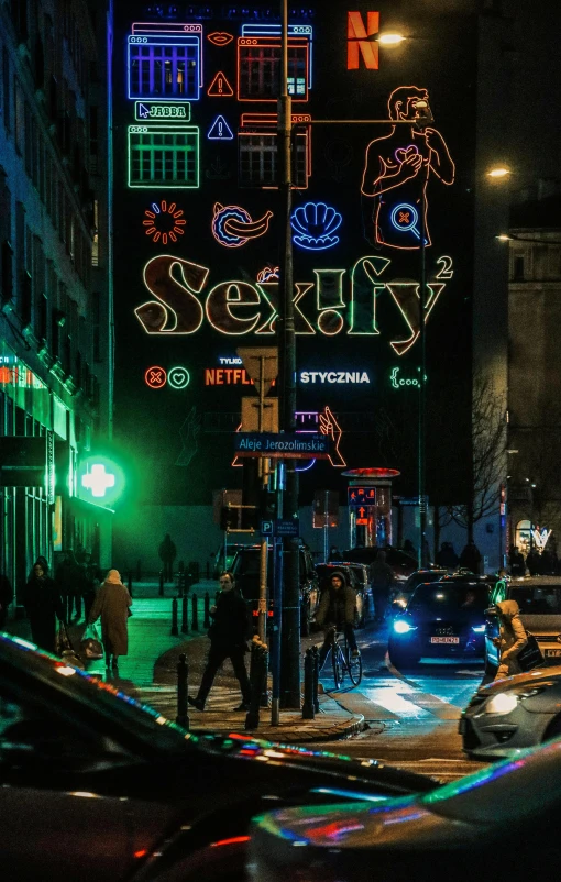 a city street with car lights lit up the night