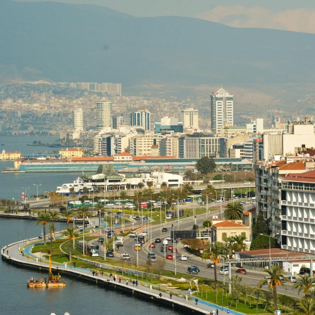 city view over water with mountains in the background