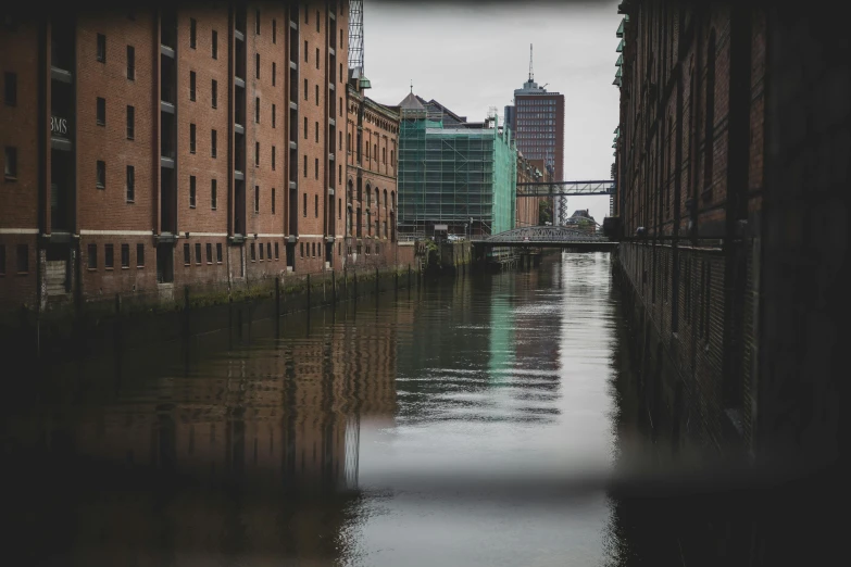 a river running through the middle of tall buildings