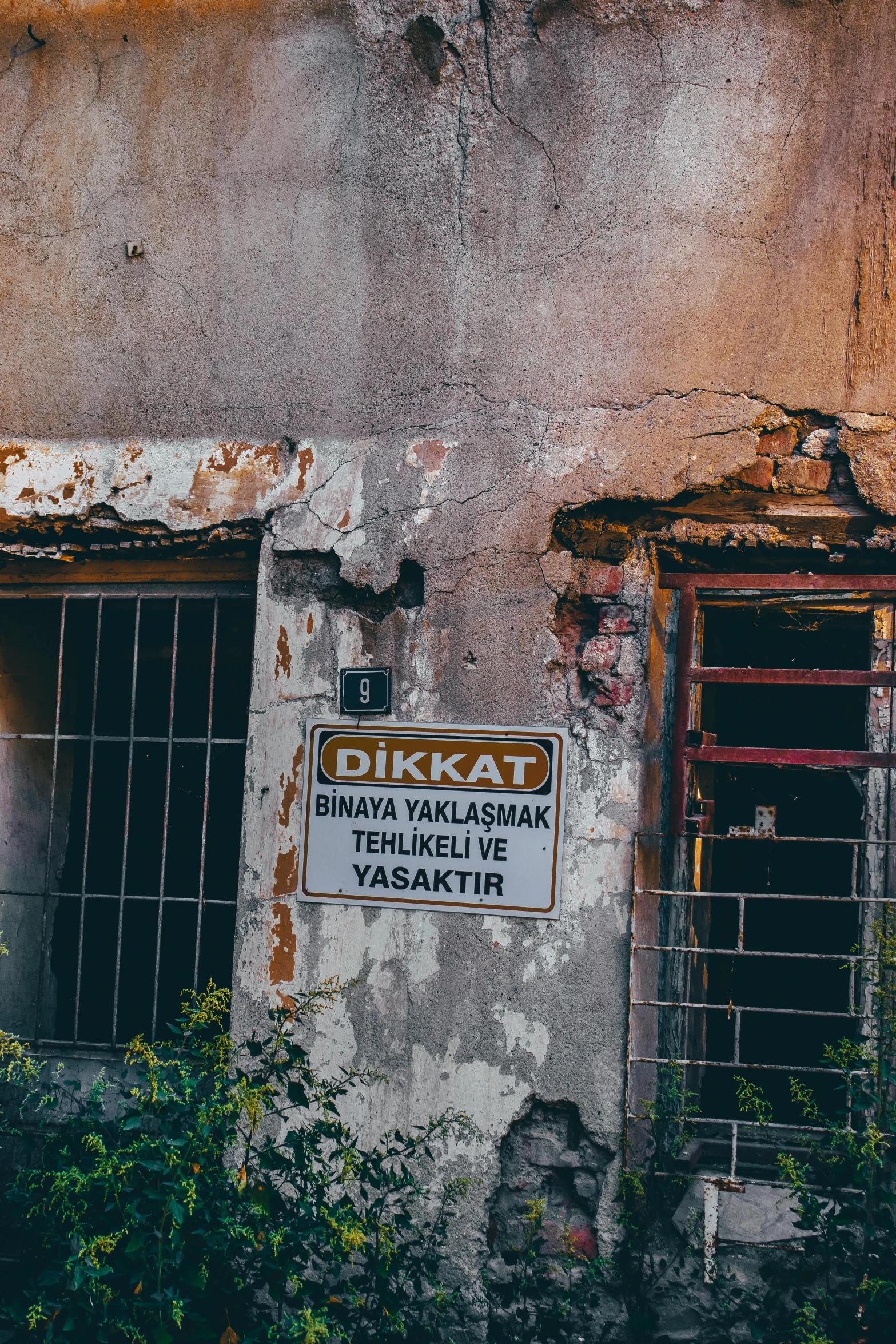 this is a dirty and dilapidated building with windows