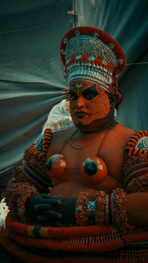 a very interesting costumed woman with silver jewelry and hair