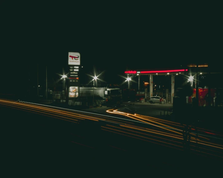 a dark po of a gas station at night