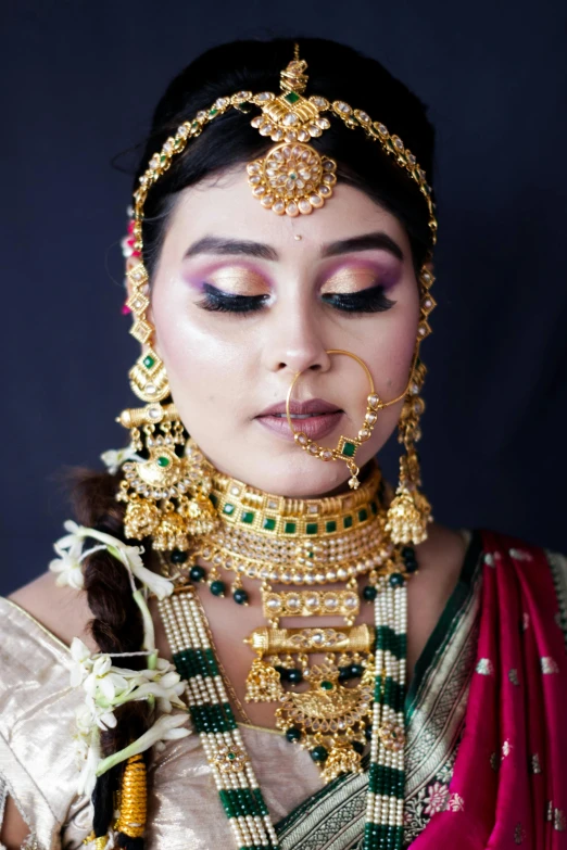 a woman with eyeliners and accessories in her face