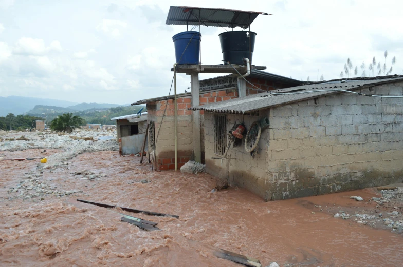 a building with water overflowing the front door