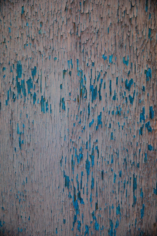 the paint on a surface has little blue streaks