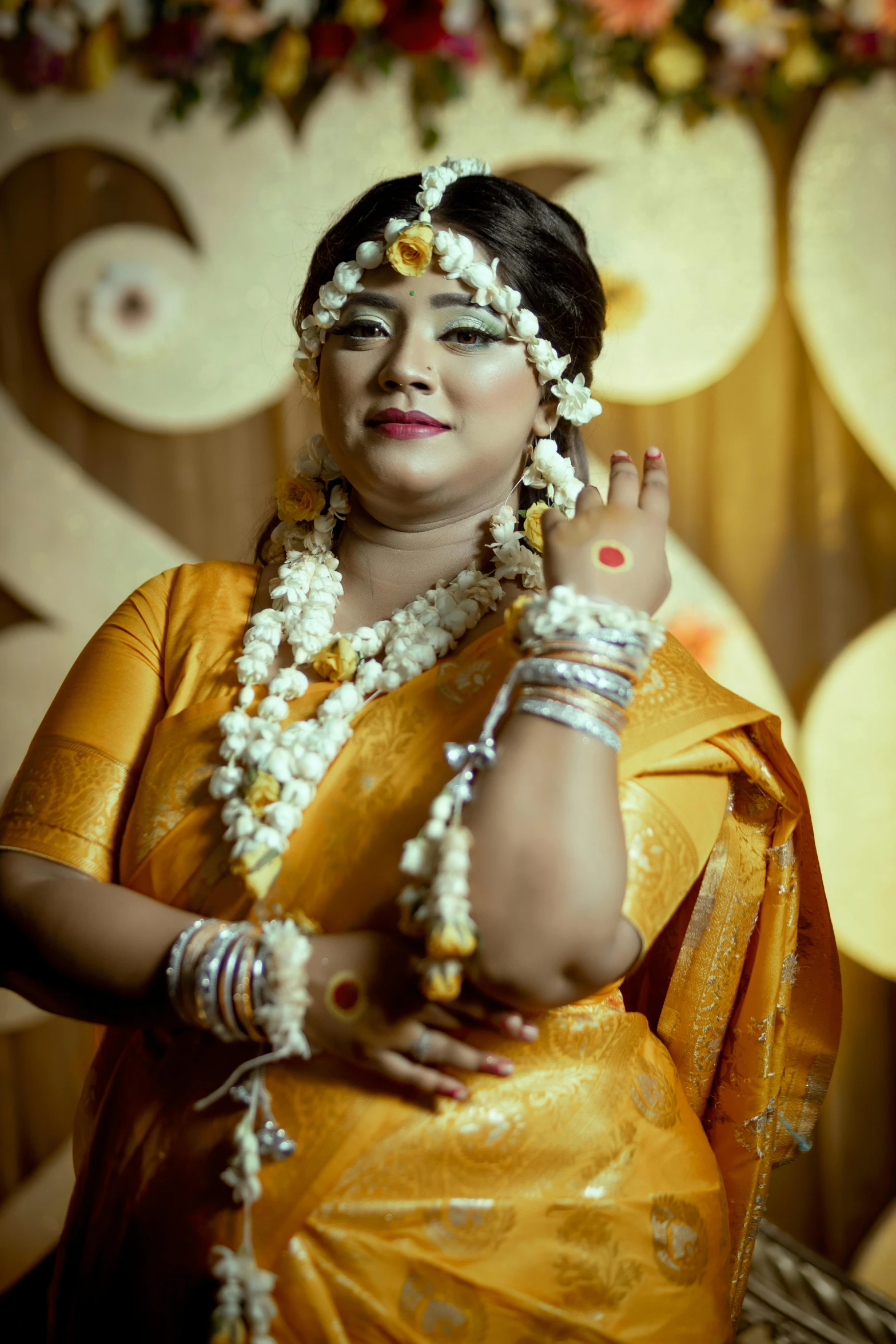 a woman with jewelry and decorations on her head