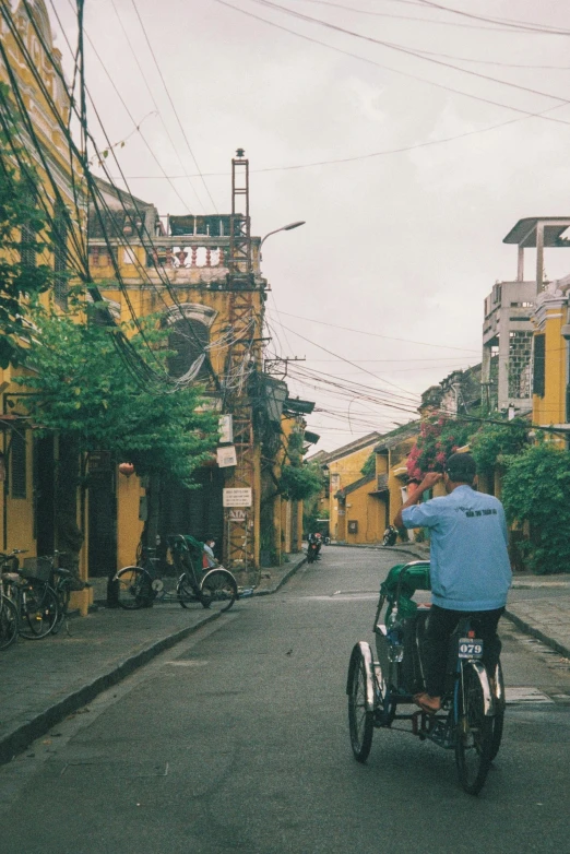 a person is riding a small bike down the street