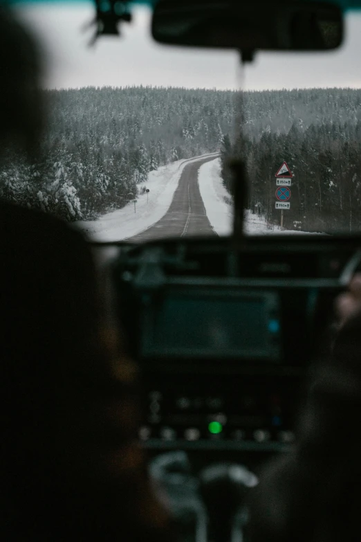 an image taken from inside the vehicle looking at a road