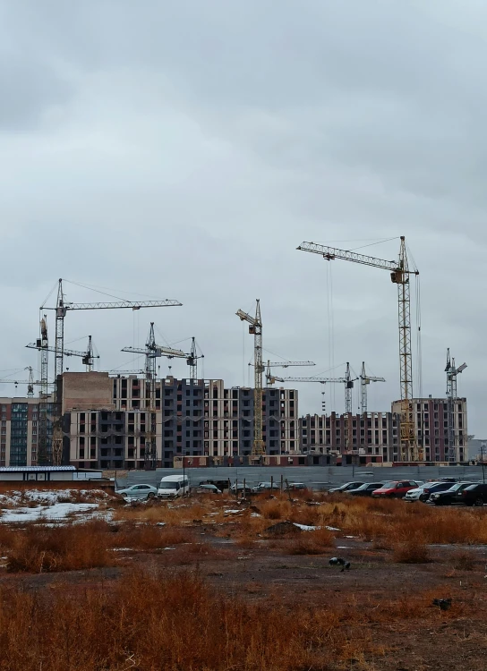 a city under construction, with a crane and crane truck