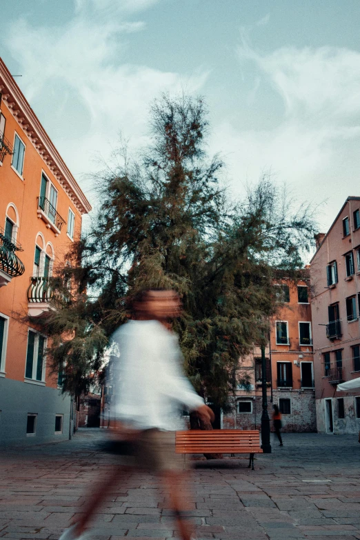 a blurred po of a person riding on a bench