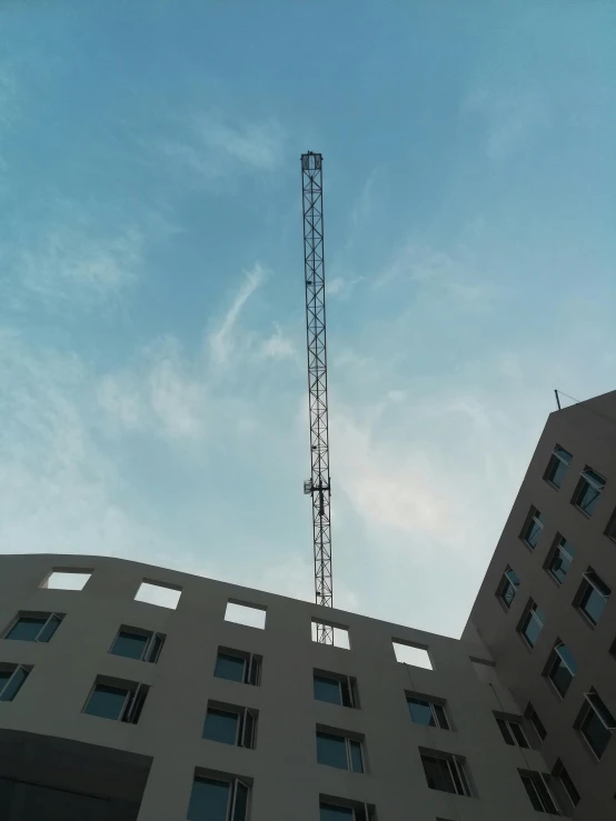 an upward view of a building, looking up into the sky