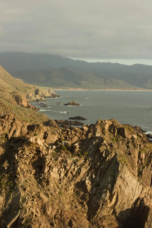 view of a large body of water from the top of a hill