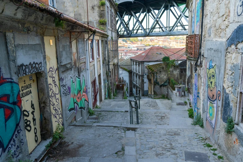 a very long alley that has graffiti all over it